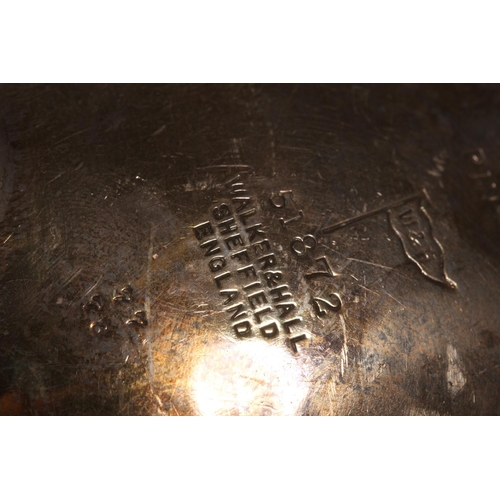 53 - Silver sauce boat with wavy edged rim raised on paw supports with scrolling handle, Walker & Hal... 