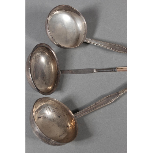 56 - Three antique silver and baleen twist handled toddy ladles, (3), longest 36cm long.