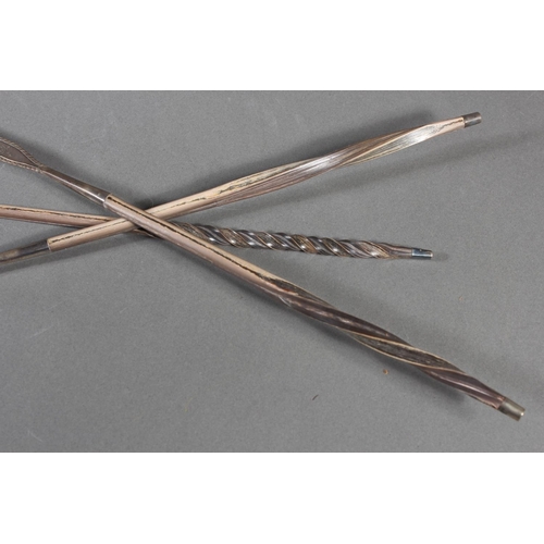 56 - Three antique silver and baleen twist handled toddy ladles, (3), longest 36cm long.