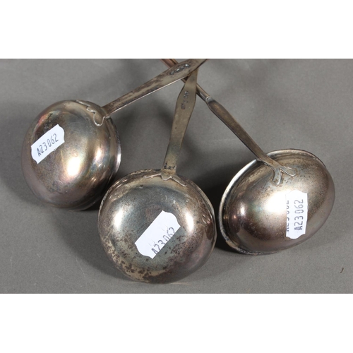 56 - Three antique silver and baleen twist handled toddy ladles, (3), longest 36cm long.