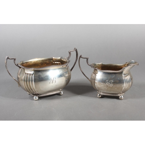 61 - Geo V silver four piece tea service raised on ball feet, Fenton, Russell & Co Ltd, London, 1913,... 