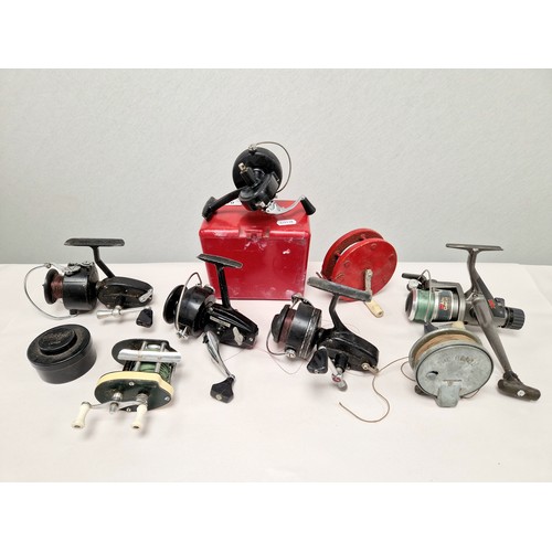 Collection of assorted fishing reels.