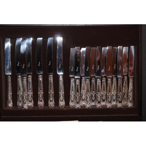 55 - Cased canteen of silver-plated flatware.