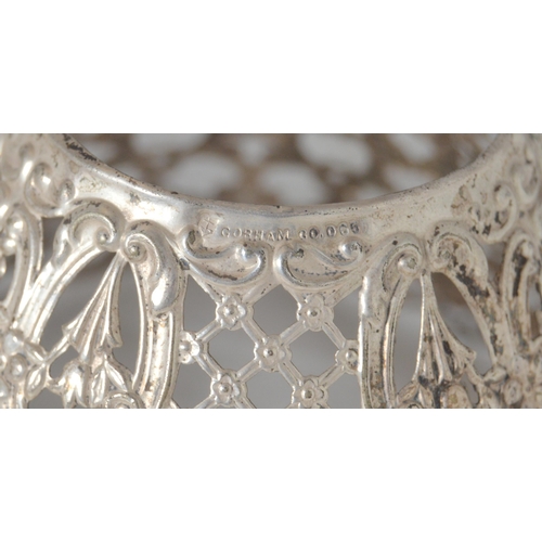53 - Three American filigree silver conical candle shades, with pierced foliage, scrolls and lattice work... 