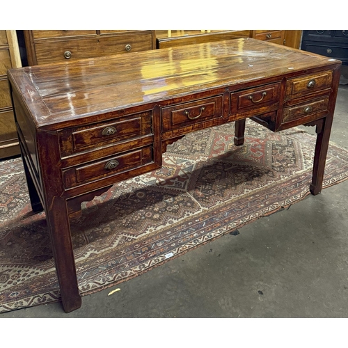 378 - Antique style Chinese hardwood multi drawer partners desk with shaped skirt.