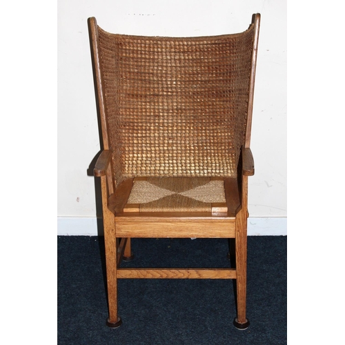 372 - Antique oak Orkney chair raised on square tapering supports.