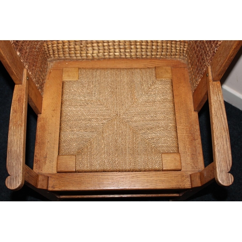 372 - Antique oak Orkney chair raised on square tapering supports.