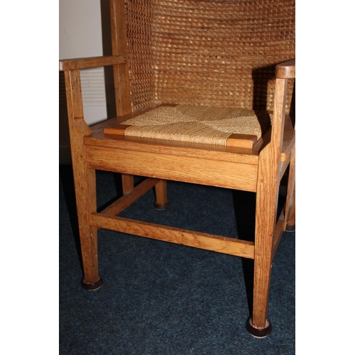 372 - Antique oak Orkney chair raised on square tapering supports.