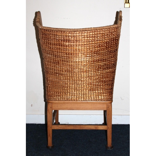 372 - Antique oak Orkney chair raised on square tapering supports.