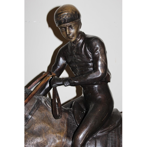 377 - In the manner of Pierre Jules Mene - large bronze effect spelter group depicting horse and jockey, 1... 