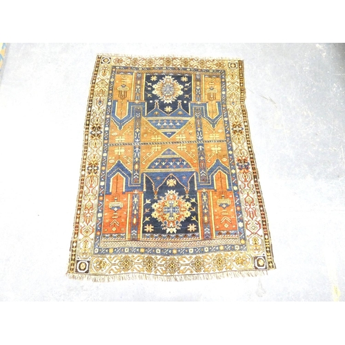 Afghan wool prayer rug having two geometric ghuls against a red, blue ...