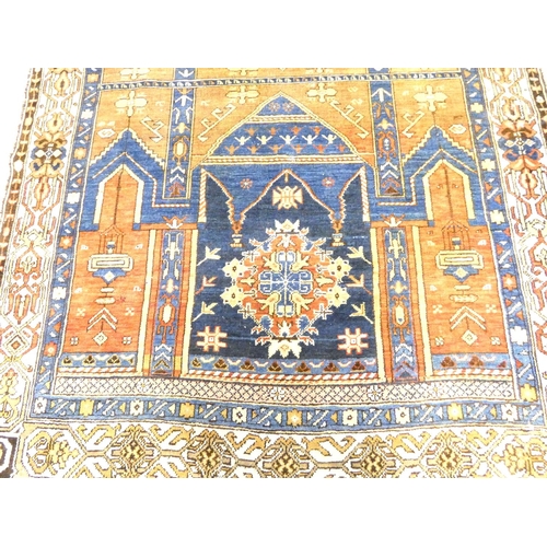 Afghan wool prayer rug having two geometric ghuls against a red, blue ...