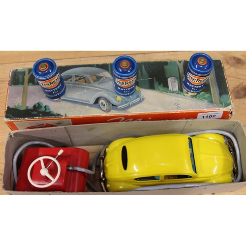 1102 - Mignon of Germany A2 Volkswagen Beetle remote control toy car, yellow plastic body with tinplate int... 