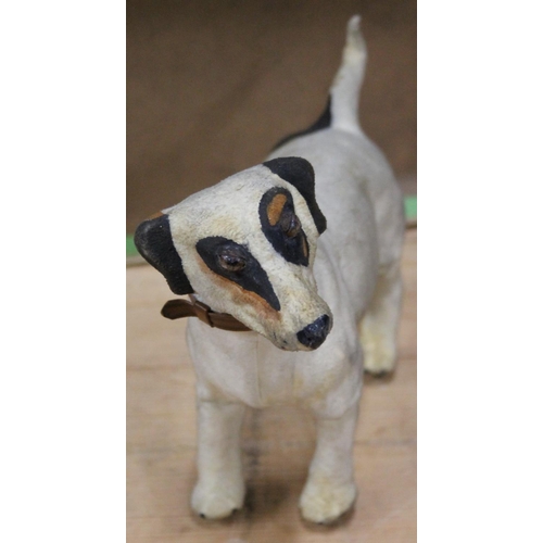 1106 - Antique clockwork automaton in the form of a Jack Russell dog, 18cm tall, held in cardboard box with... 