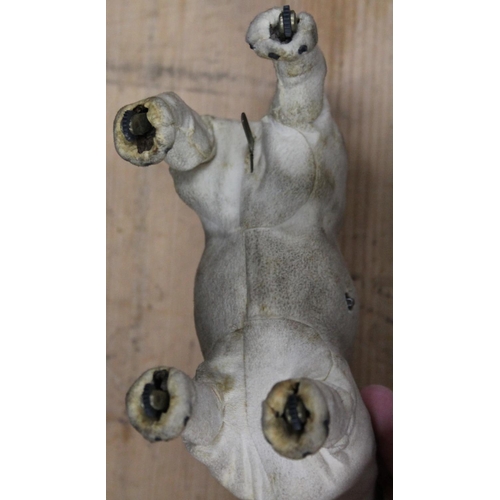 1106 - Antique clockwork automaton in the form of a Jack Russell dog, 18cm tall, held in cardboard box with... 