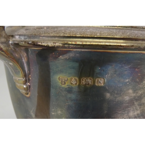 40A - Silver bachelor's three-piece tea service comprising a teapot, sugar and cream, by Davidson, Henders... 
