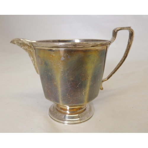 40A - Silver bachelor's three-piece tea service comprising a teapot, sugar and cream, by Davidson, Henders... 