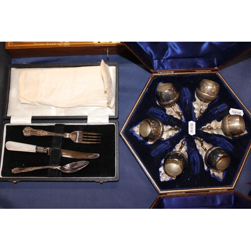 110 - Cased set of thistle style condiments, Christening set and a canteen of fish cutlery.