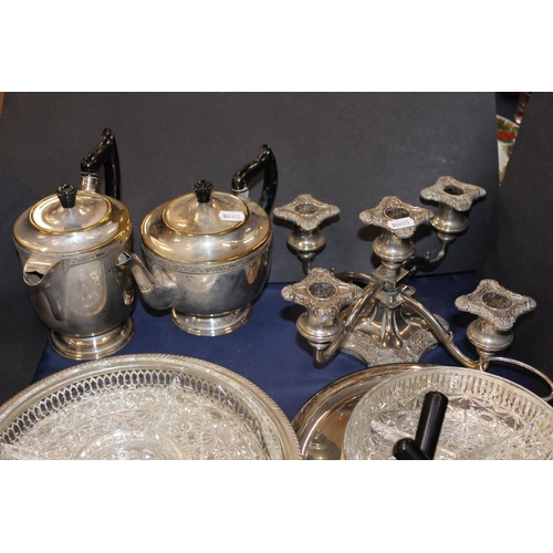 148 - Collection of silver plate including a candelabra, four piece tea service, etc.