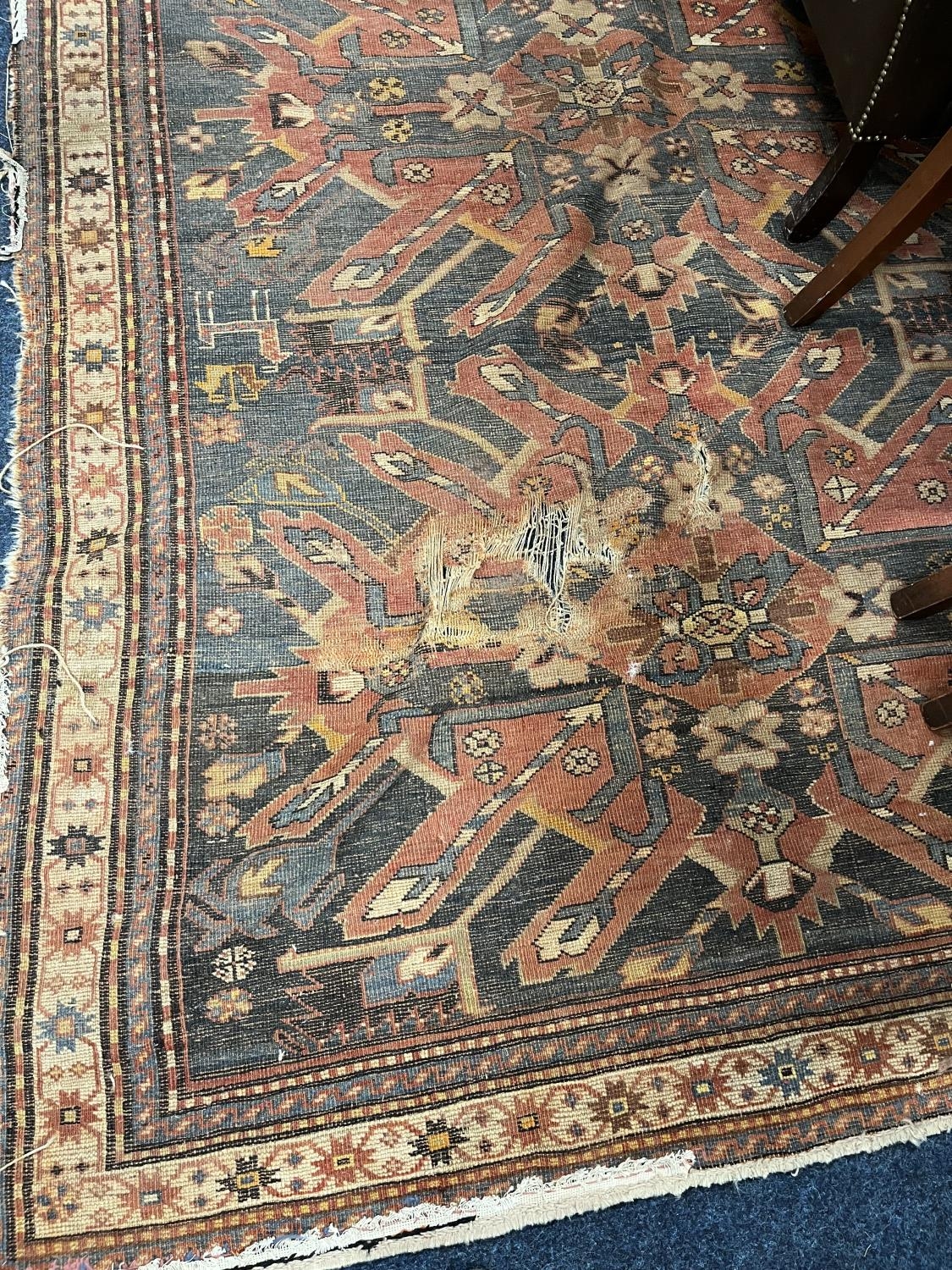 Blue ground multi border fringed rug with geometric decoration, 275x168cm.