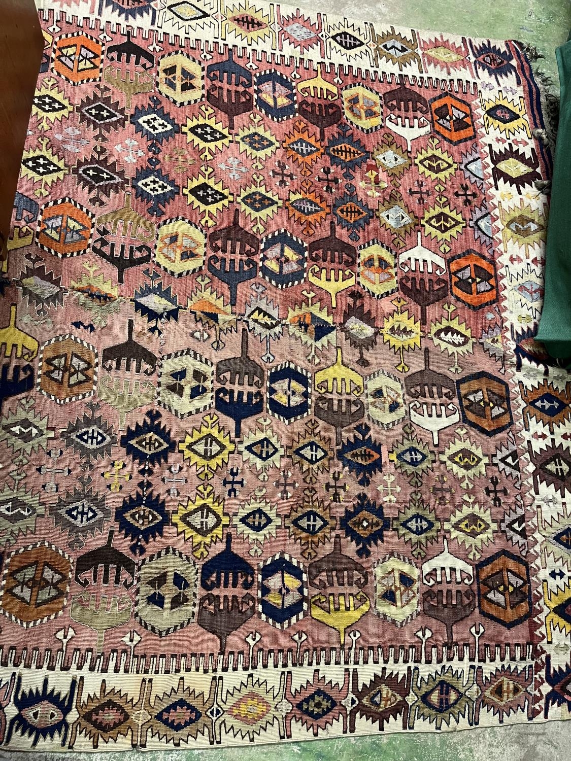 Pink ground stitches pair of geometric pattern runners, 337cm x 173cm.