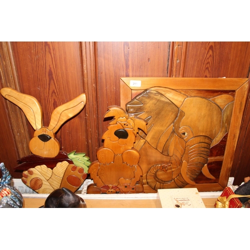 250 - Sidlaw Woodcarfts od Dundee, three carved wooden wall plaques to include Elephant, Scruffy dog and R... 