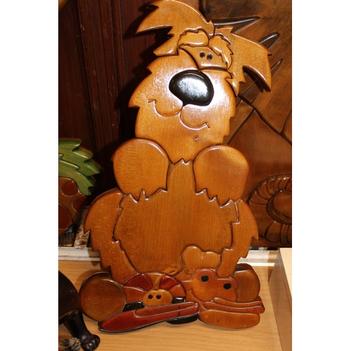 250 - Sidlaw Woodcarfts od Dundee, three carved wooden wall plaques to include Elephant, Scruffy dog and R... 