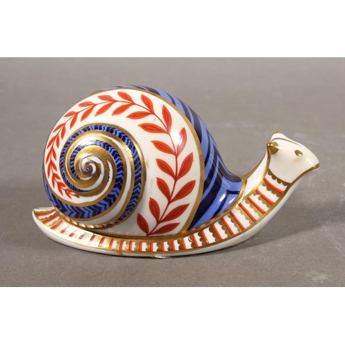 287 - Royal Crown Derby snail paperweight and a Cottage Garden Kitten. (2)