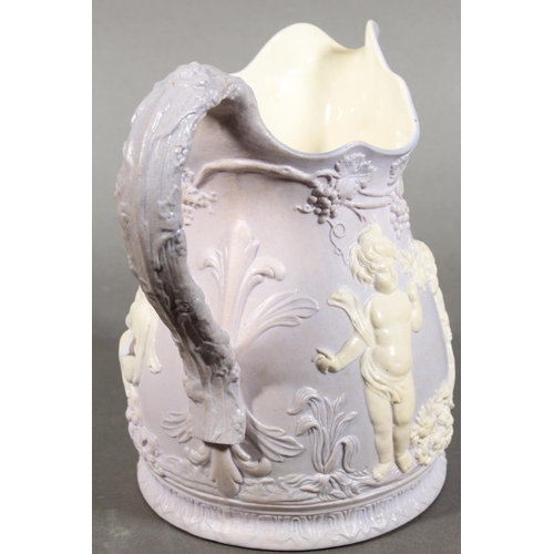 318 - Portmerion style relief moulded jug depicting cherubs.