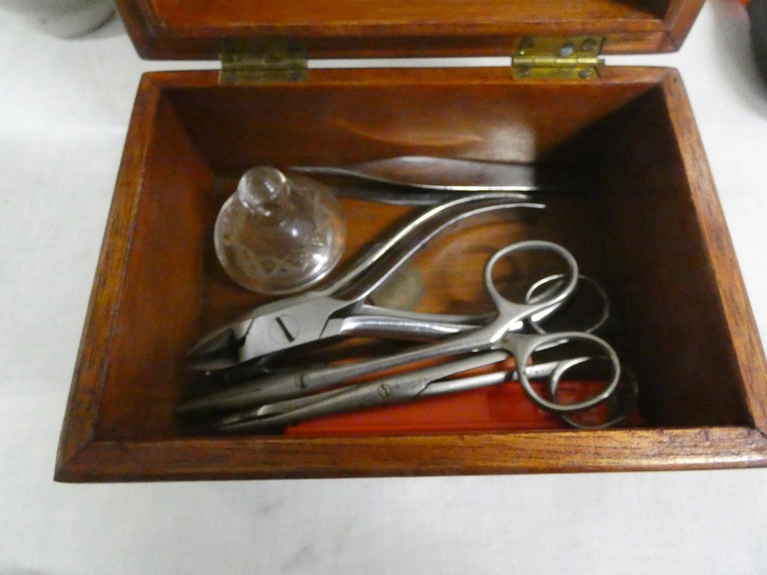 Treen box with surgical tools.