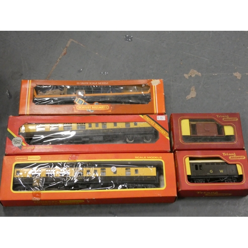 124 - Two cartons containing Hornby OO gauge models to include boxed coaches, also boxed Bachmann wagon, t... 