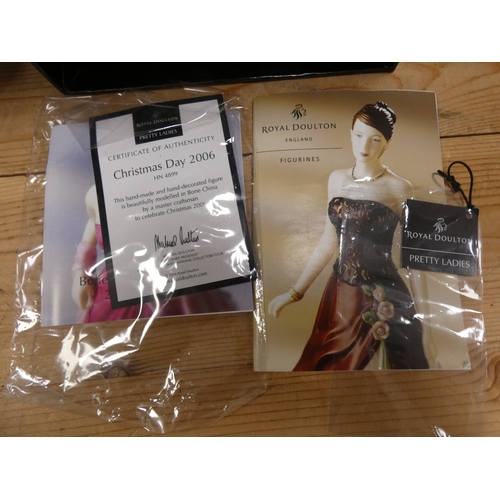 133 - Two Royal Doulton figures to include 'Christmas Day 2006', and 'English Rose', both boxed.  (2)