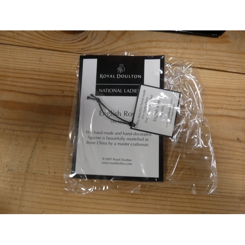 133 - Two Royal Doulton figures to include 'Christmas Day 2006', and 'English Rose', both boxed.  (2)
