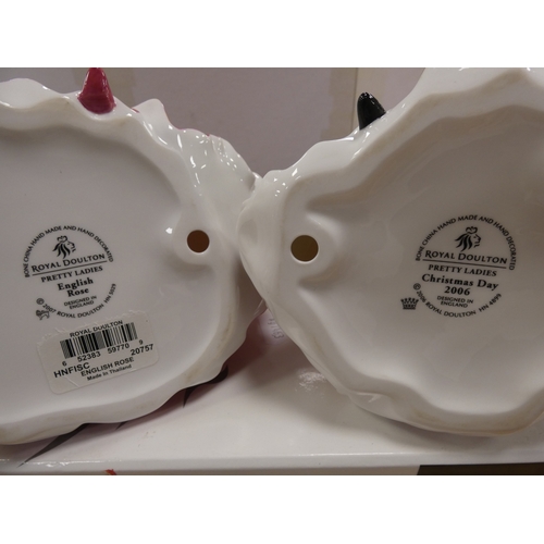 133 - Two Royal Doulton figures to include 'Christmas Day 2006', and 'English Rose', both boxed.  (2)