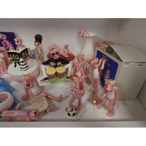147 - Collection of Pink Panther collectables to include porcelain figures, book, coin bank, puppet, mug e... 
