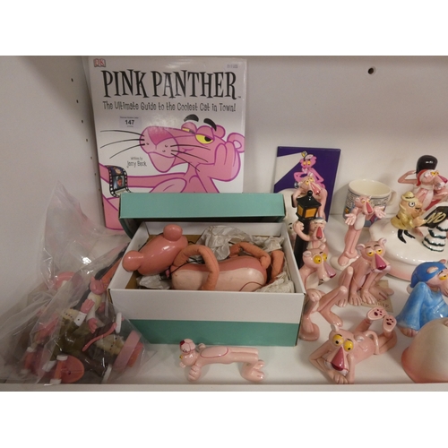 147 - Collection of Pink Panther collectables to include porcelain figures, book, coin bank, puppet, mug e... 