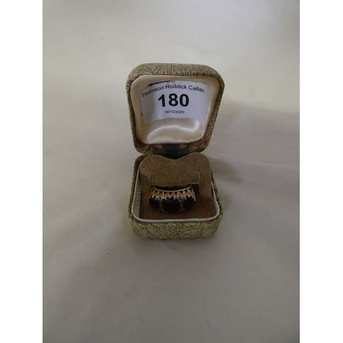 180 - 9ct gold garnet three-stone ring, '375', size S, 3.6g gross.