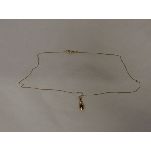 181 - 9ct gold gem-set pendant on a 9ct gold chain, '375', 2.3g gross.