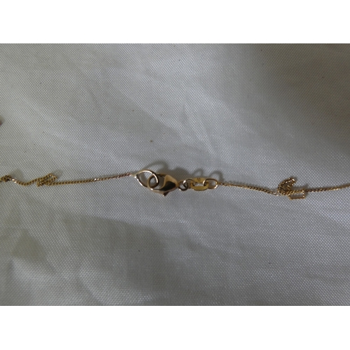 181 - 9ct gold gem-set pendant on a 9ct gold chain, '375', 2.3g gross.