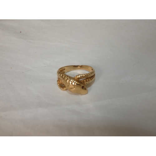 192 - 9ct gold snake ring, '375', with red gem-set eyes, size T/U, 4.3g gross.