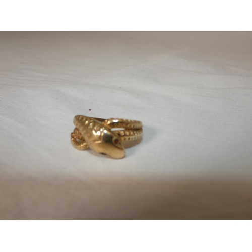 192 - 9ct gold snake ring, '375', with red gem-set eyes, size T/U, 4.3g gross.