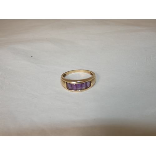 193 - Gold and channel-set gem ring, size T, 3.5g gross.