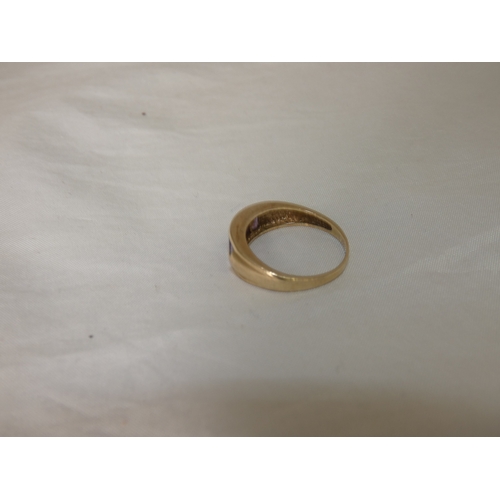 193 - Gold and channel-set gem ring, size T, 3.5g gross.