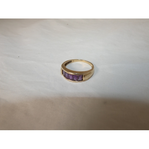 193 - Gold and channel-set gem ring, size T, 3.5g gross.