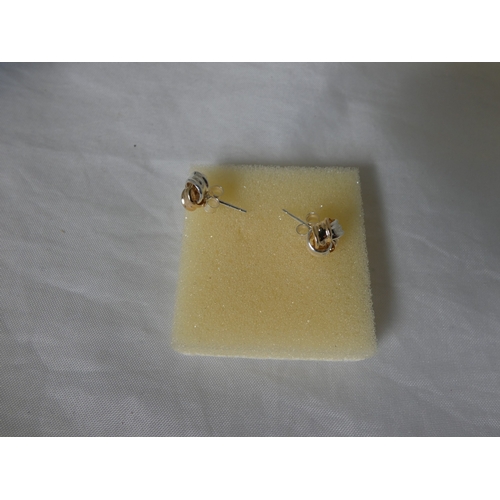 194 - Three pairs of ladies' earrings to include cubic zirconia examples, unmarked, possibly on gold, boxe... 