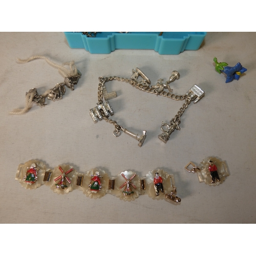 202 - Collection of decorative jewellery and badges to include military-themed badges and buttons, British... 