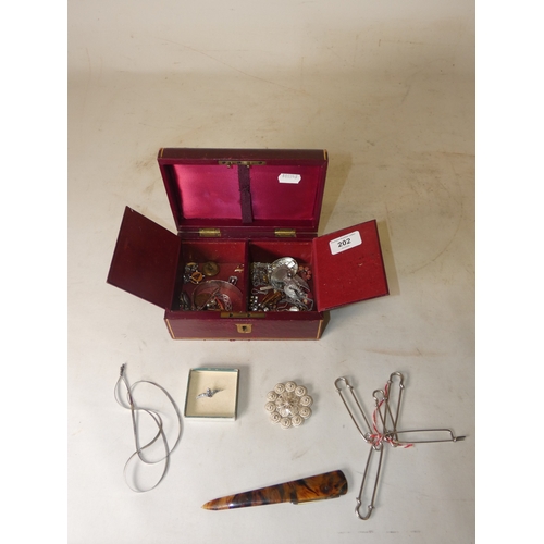 202 - Collection of decorative jewellery and badges to include military-themed badges and buttons, British... 