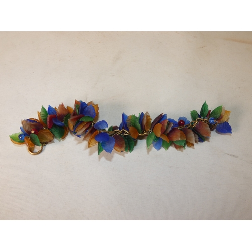 202 - Collection of decorative jewellery and badges to include military-themed badges and buttons, British... 