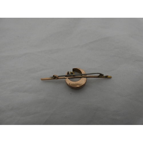 214 - Late Victorian sapphire and seed pearl crescent brooch on unmarked yellow metal.