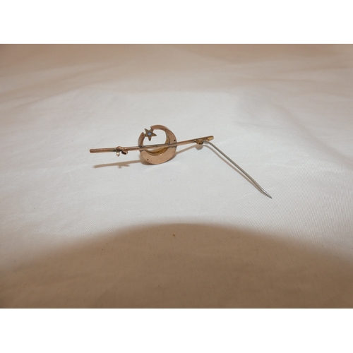 214 - Late Victorian sapphire and seed pearl crescent brooch on unmarked yellow metal.